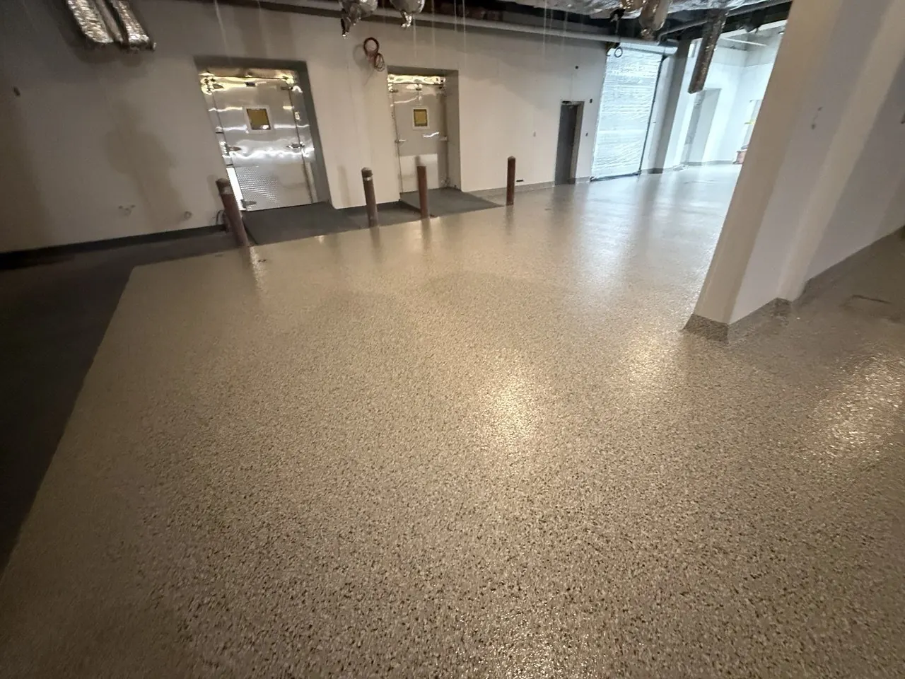 Commercial kitchen flake epoxy floor Naples FL — Walk-in freezer entrance — thermal transition zone