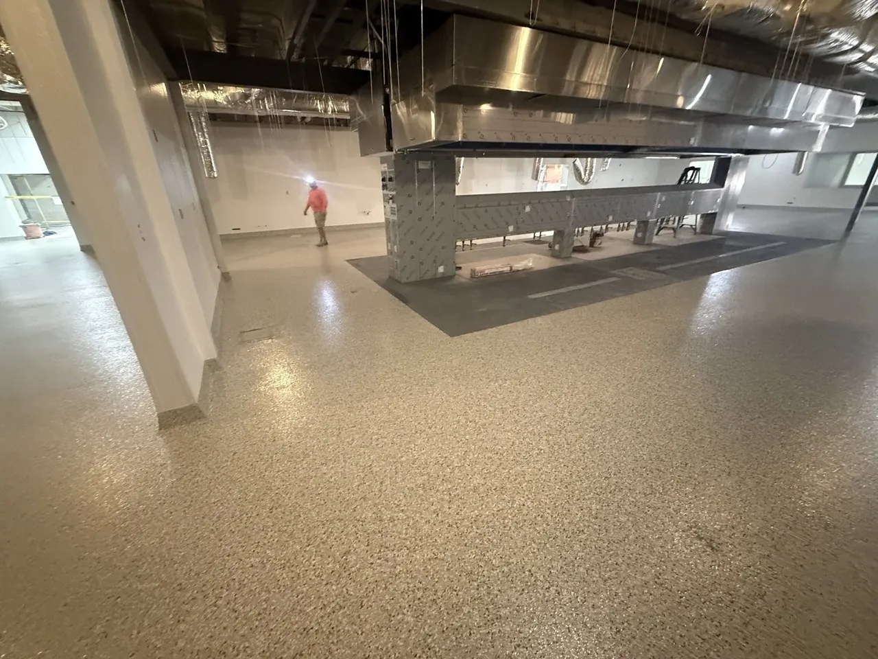 Commercial kitchen flake epoxy floor Naples FL — Main hot line — under fryer & grill