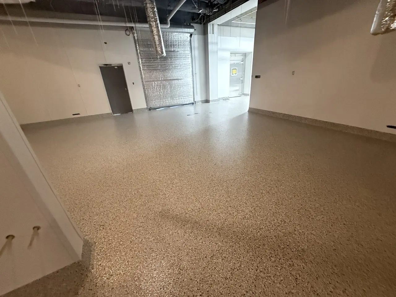 Commercial kitchen flake epoxy floor Naples FL — Dry storage — warm tan flake