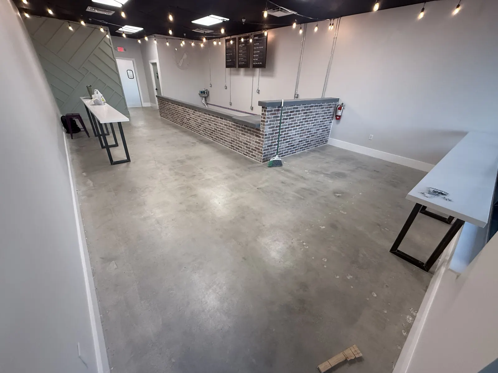 Restaurant concrete floor before clear epoxy coating Naples FL - commercial food service flooring